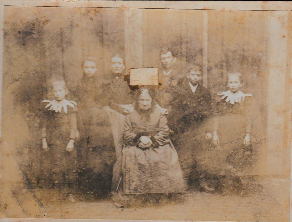 Why Was Someone's Face Cut Out of This Old Family Photo?