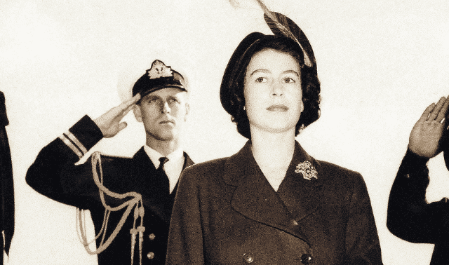 The Duke of Edinburgh salutes his wife, then-Princess Elizabeth, as they step aboard a US Navy ship in 1950