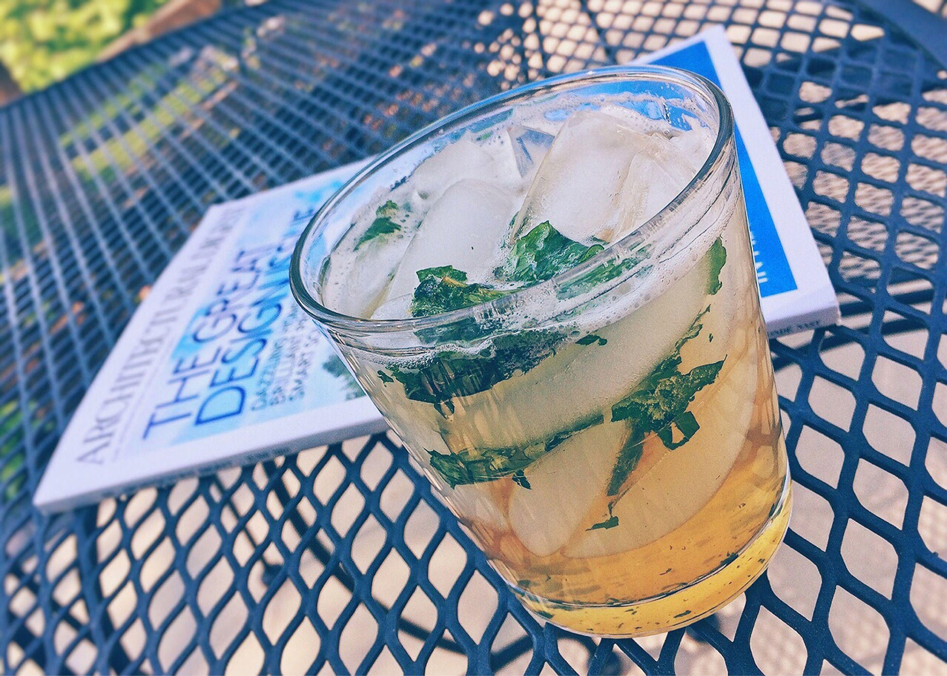 Mint julep cocktail on a patio table.
