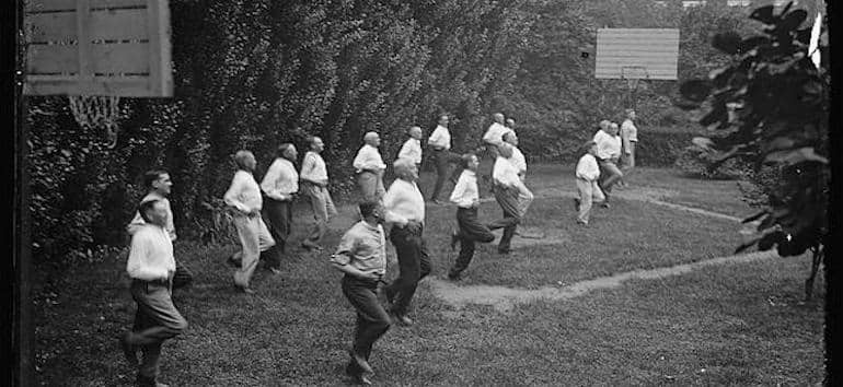 Vintage photo of a group of men exercising.