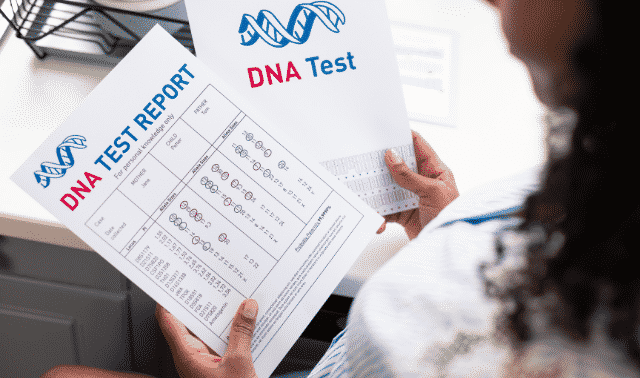 Woman holding DNA test results.